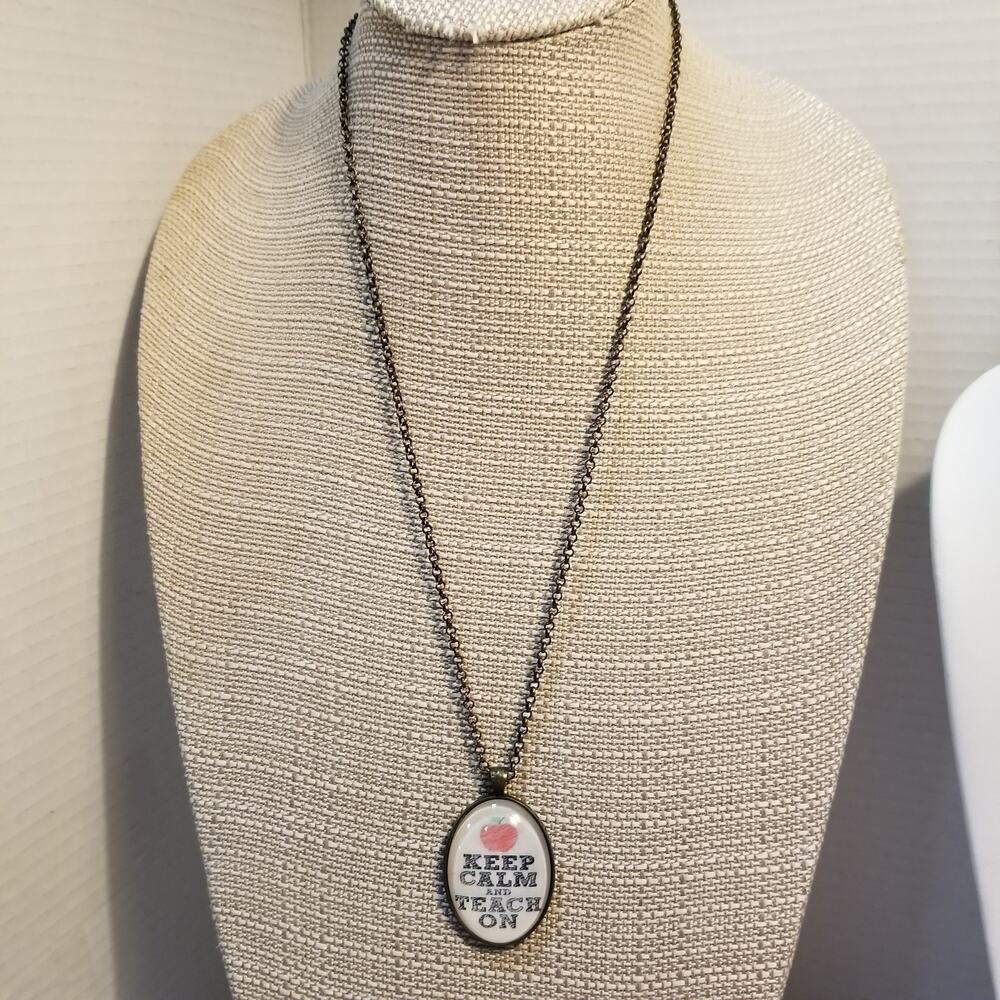 Keep calm and teach on pendant necklace w/ bronze toned chain 24"w/ 2" pendant